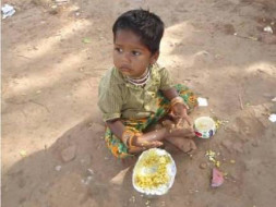 Feed a nutritious meal to a hungry street child on the street/Slum