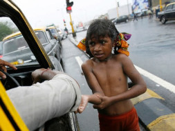 Poor children sleeping open on road join us in providing them clothes