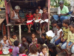 Helping the Poor Boy learn to read the Girls