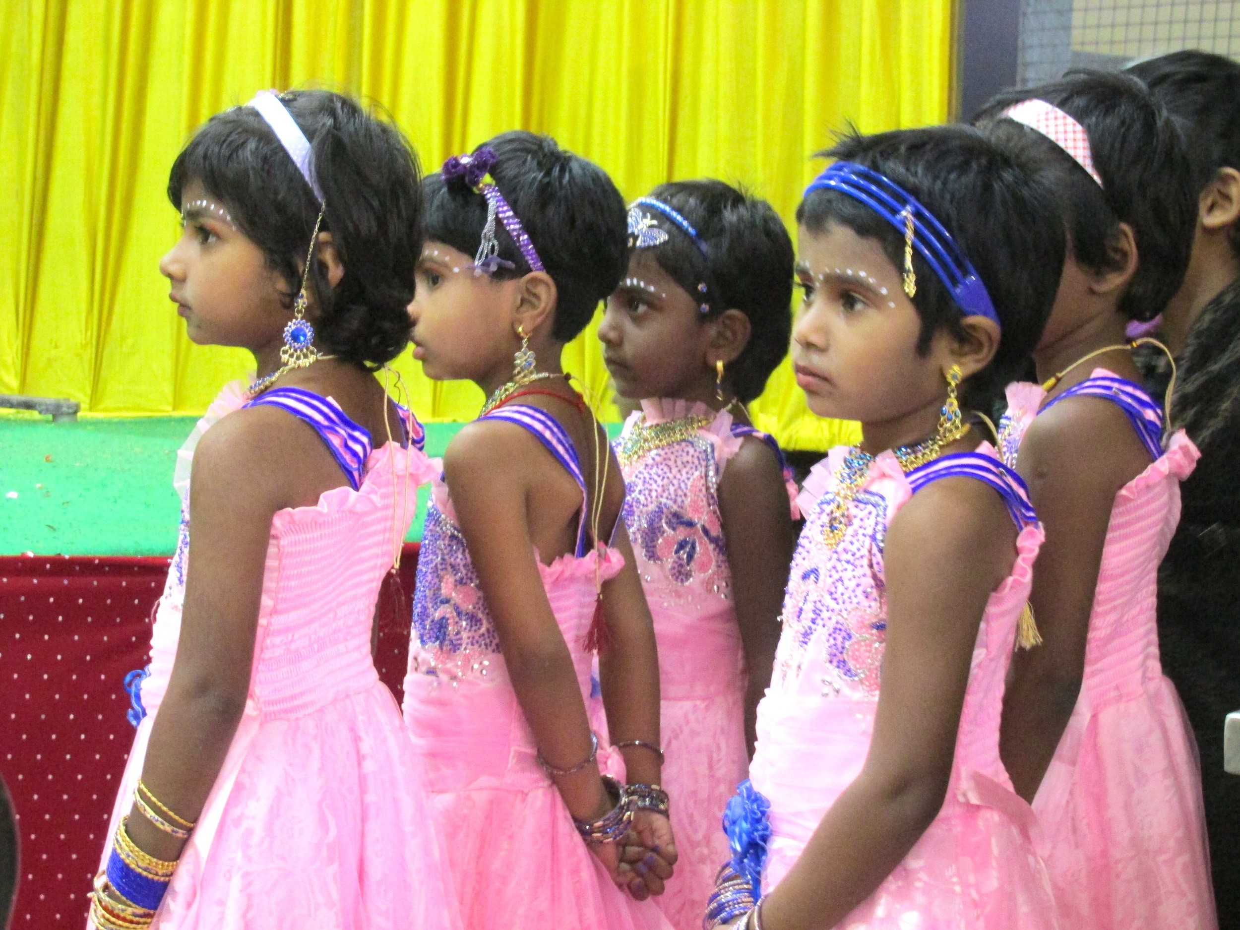 3rd standard girls patiently waiting their turn