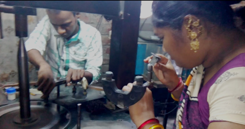 Workers polishing artificial diamond