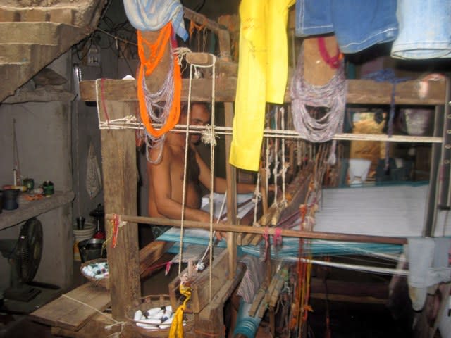 The take up roll is seen at the bottom of the handloom.