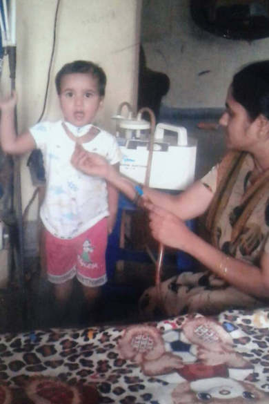 Removing secretions image of patient S. Jathin Raj and his mon saritha