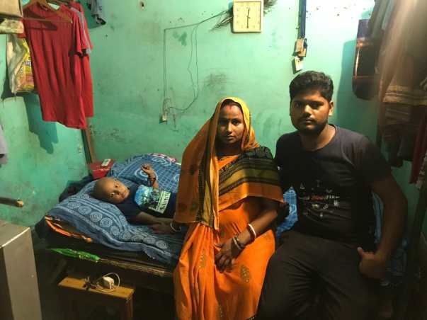 Atish with his father and 5 months pregnant mother