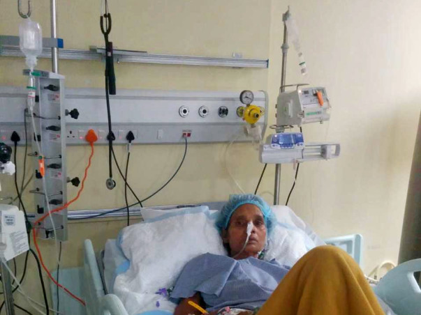 Help Meena Fight Cancer and Paralysis