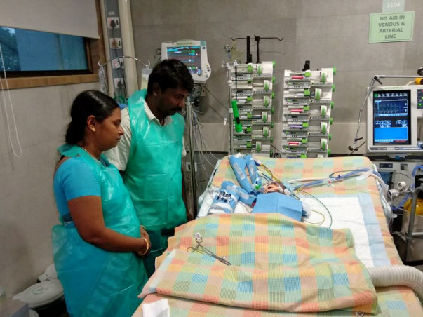 Kalimuthu's baby was born with a heart disease and is now in the ICU