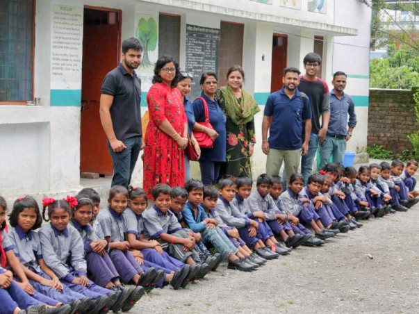 "NAVV SHIKSHA"Providing shoes,bag,story book,sweater etc to students