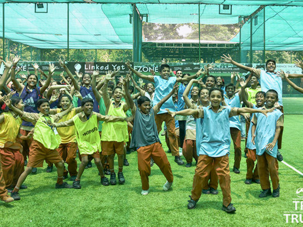 Help 100 underprivileged children participate in Football League