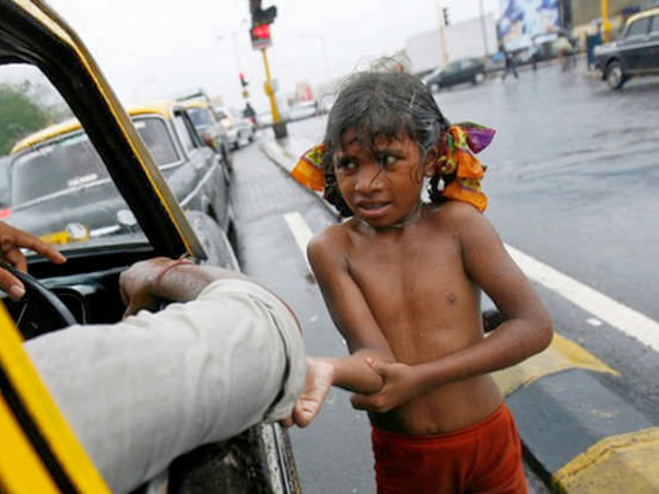 Poor children sleeping open on road join us in providing them clothes
