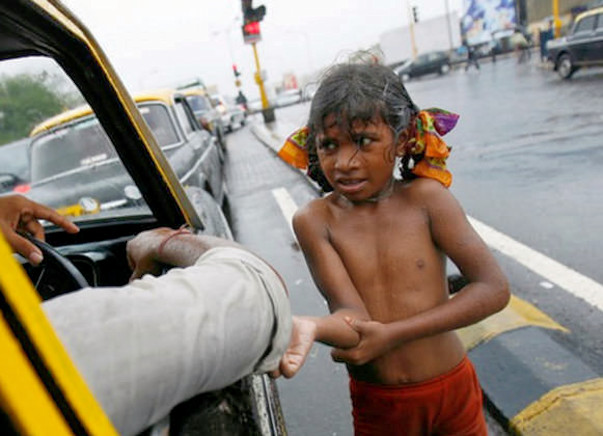Poor children sleeping open on road join us in providing them clothes