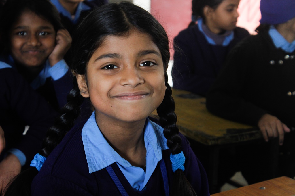 A student giving a sweet smile A student giving a sweet smile