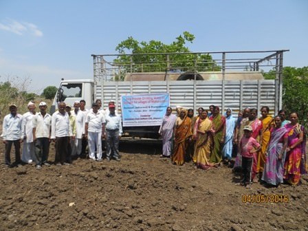 A view of meeting near the drinking water well with the village community