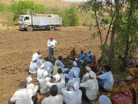 A view of meeting near the drinking water well with the village community