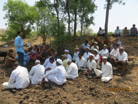 A view of meeting near the drinking water well with the village community